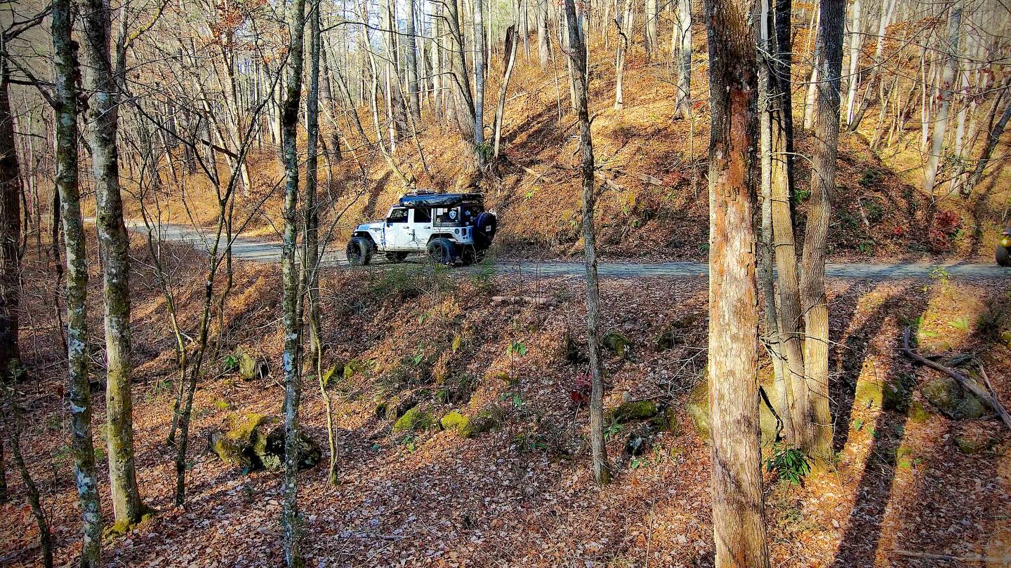 Out exploring the North Georgia mountains again and it was a solid day on the trail.
Me and English working our way through the trees, easing over some washed-out sections and flexing through the crevices like they’re supposed to. Nothing wild, just real trail riding where you’ve got to slow down, pick your line, and let the suspension do its job.
That’s the kind of stuff I enjoy most… being out in the mountains with good people and capable rigs, just seeing where the trail takes us.
If you want to ride along with us on this one, you can join the full adventure over on the Road Rash Off Road YouTube channel.