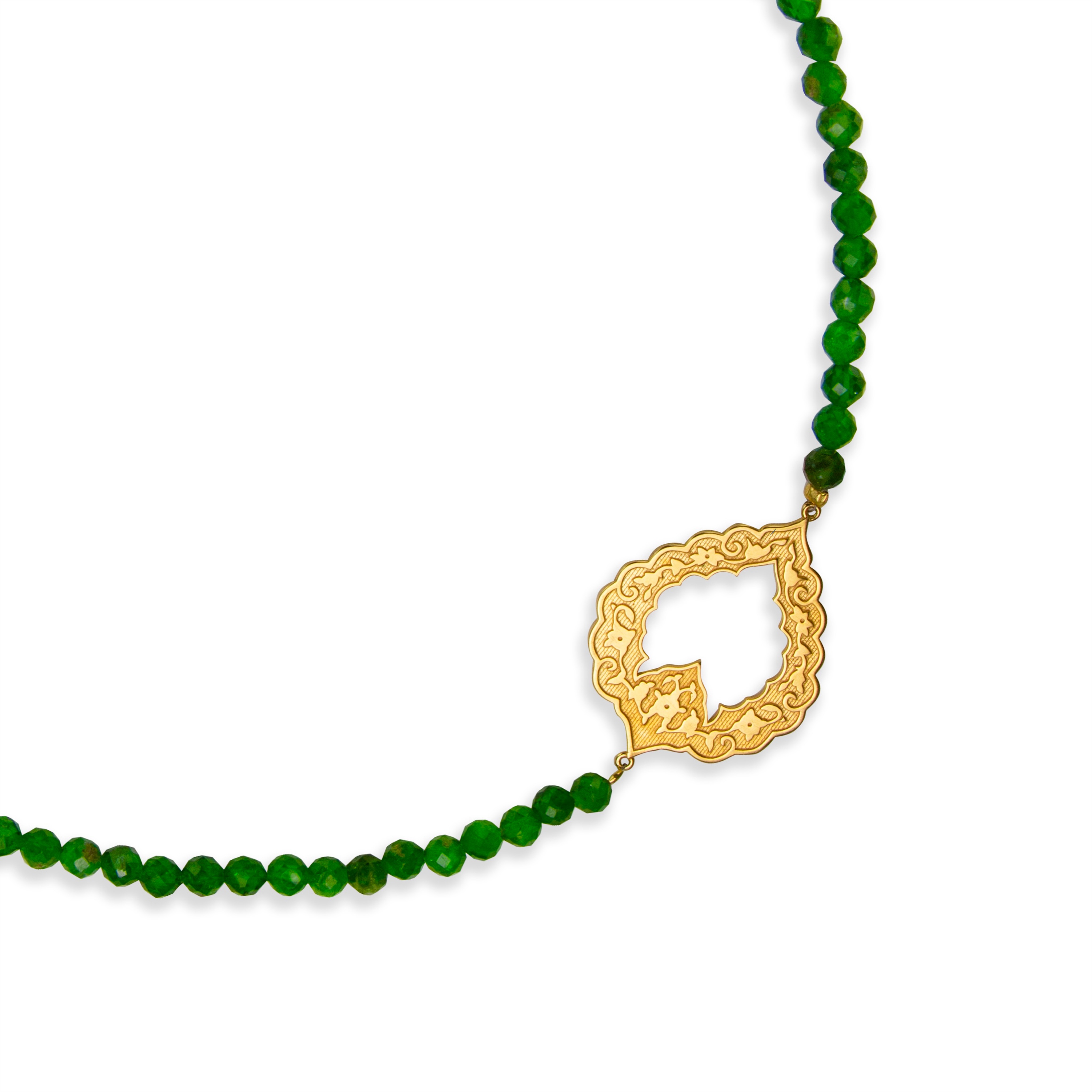 I’ve always been drawn to the beauty of architectural details, the carved openings, the rhythm of repeating forms, and the way light transforms them throughout the day. This piece is inspired by those timeless forms, handmade in 18k gold and diopside.
.
#sanazdoost #thisiscouture #finejewellery
